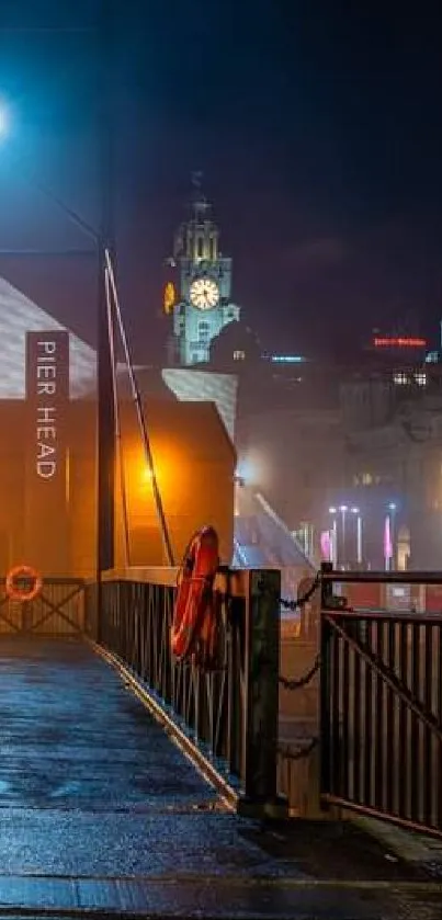 Misty bridge with vibrant city lights in the background at night.