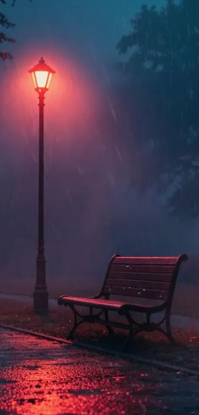 Misty night park with glowing lamp and bench.