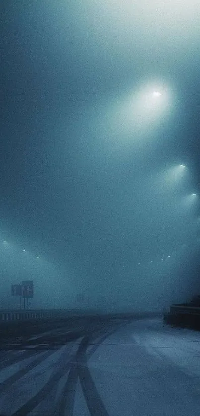 Foggy night road with streetlights casting a serene blue glow.