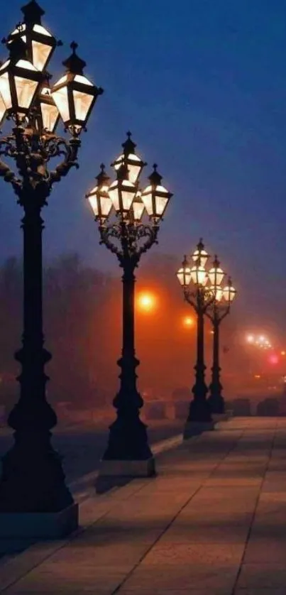 Misty street lamps illuminate a nightly path in serene urban setting.