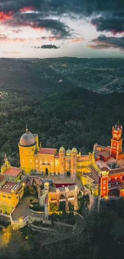 Aerial view of a vibrant palace surrounded by lush forest under a misty sky.