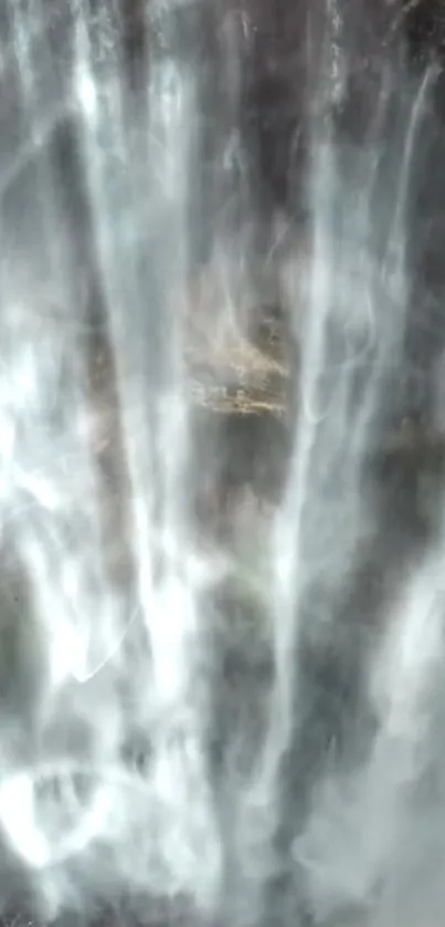 Misty waterfall creating a serene and ethereal atmosphere for mobile screens.