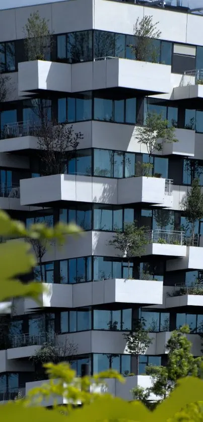 Modern urban building with angular balconies and lush greenery.