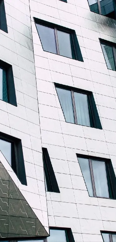 Modern geometric architectural building facade with windows.