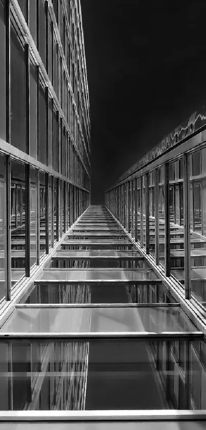 Symmetrical grayscale architectural design with reflective windows.