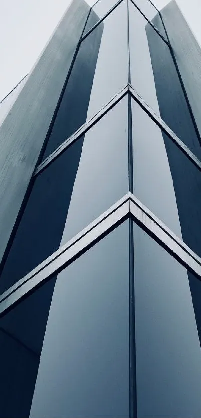 Modern skyscraper with reflective blue glass panels.