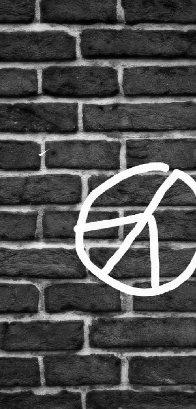 Black brick wall with white graffiti circle design.