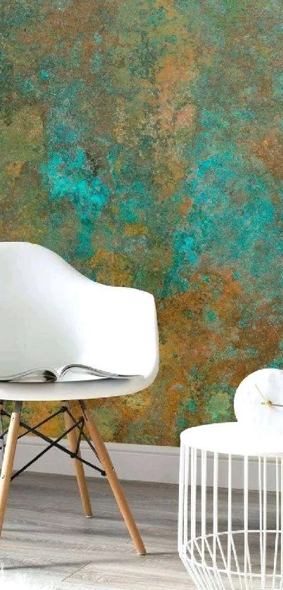 Modern chair with abstract teal wall design and round table.