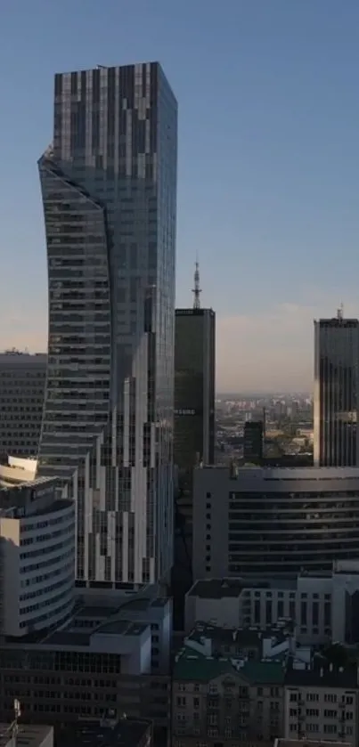 Modern skyscraper with city backdrop under a clear sky.