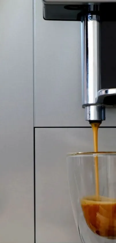 Modern coffee machine pouring espresso into a glass cup.