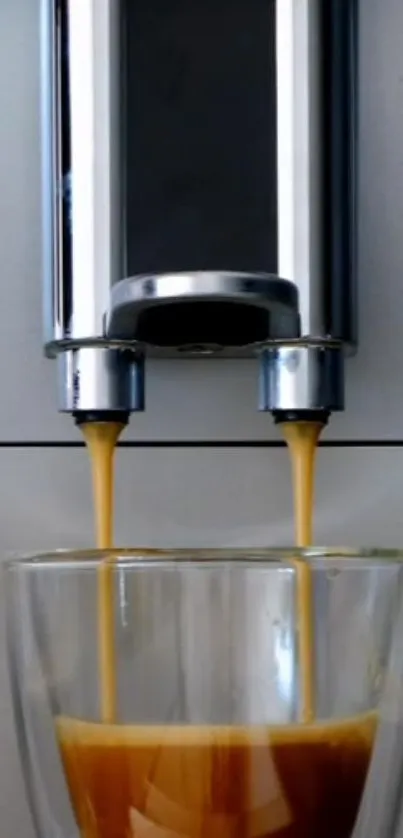 Espresso pouring from coffee machine into glass cups.