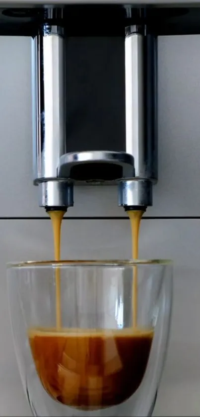 Sleek espresso coffee machine pouring into a glass cup.