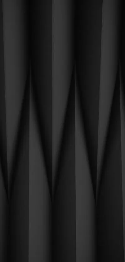 Sleek black geometric wallpaper with folded patterns.