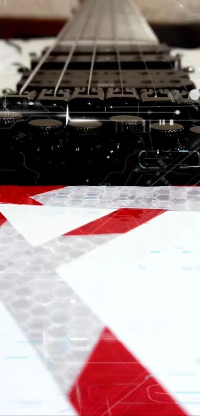 Close-up of a guitar with red, white, and black design patterns.