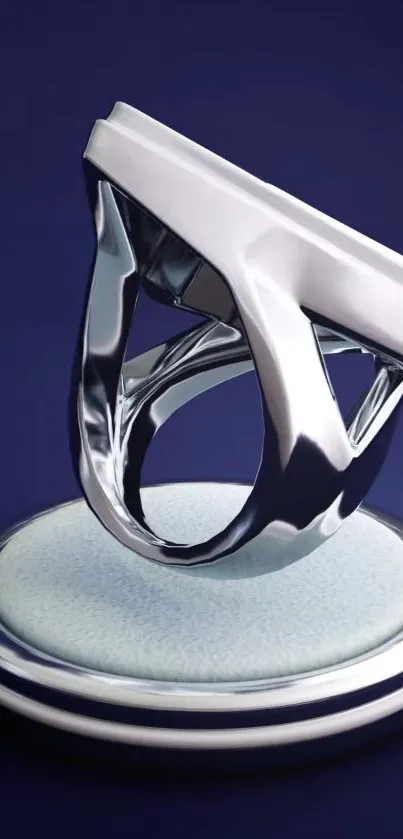 Futuristic silver sculpture on navy background.