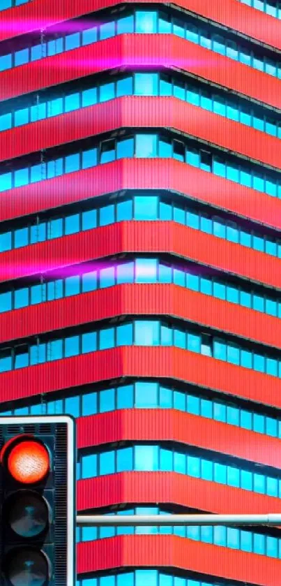 Vibrant red building with geometric lines and a traffic light in foreground.