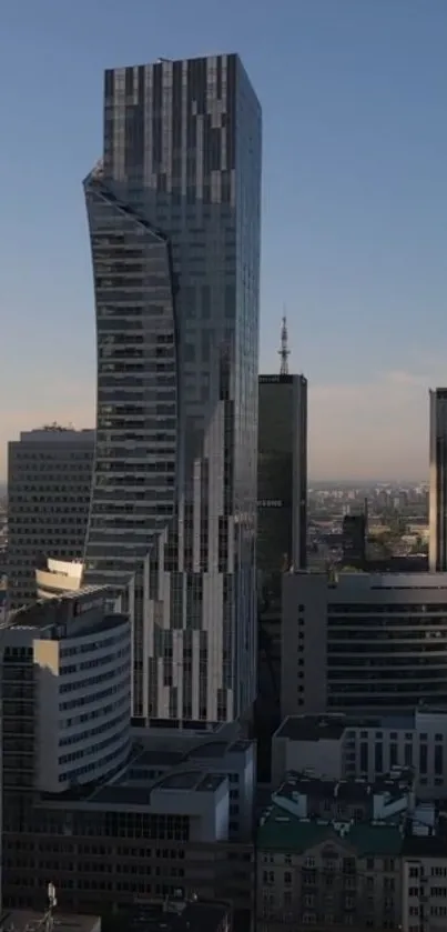 Modern skyscraper and city skyline at dusk.