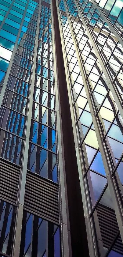 Skyscraper with reflective blue glass panels under a clear sky.