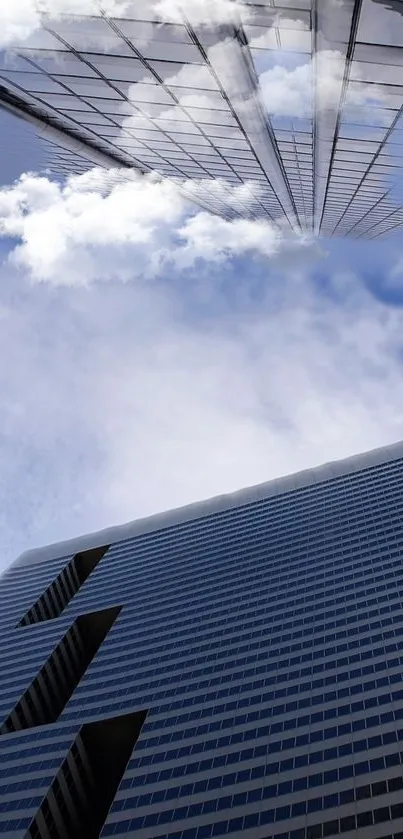 Modern skyscraper against blue sky with clouds.