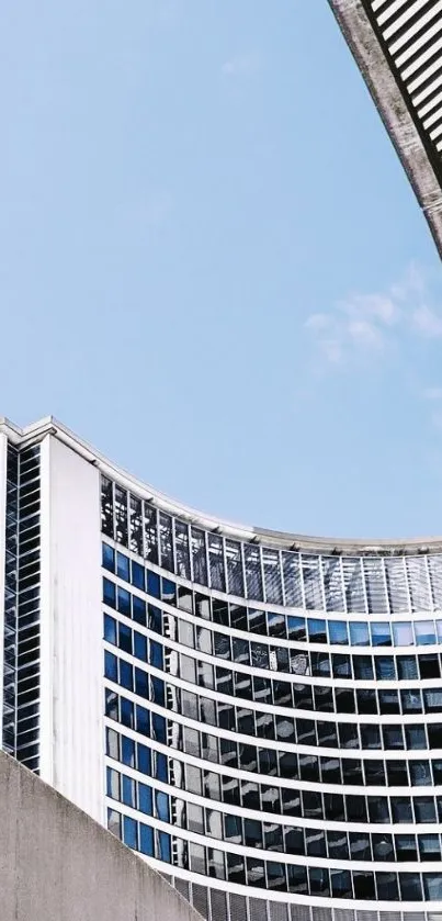 Urban skyscraper against a clear blue sky.