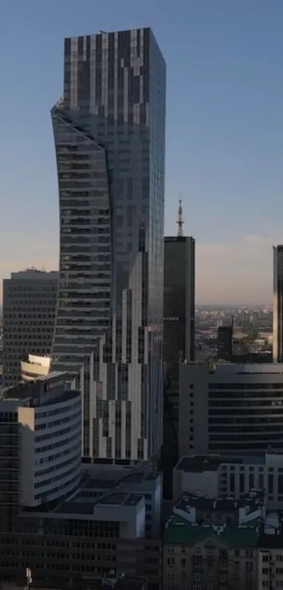 Futuristic skyscraper against a clear blue sky with urban surroundings.