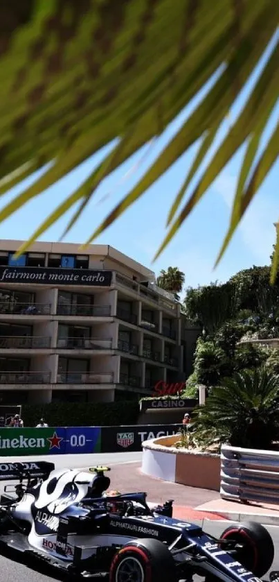 Formula 1 car racing on Monaco's street circuit under palm tree.