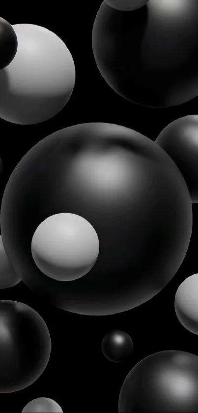 Monochrome 3D black and gray spheres on a dark background wallpaper.