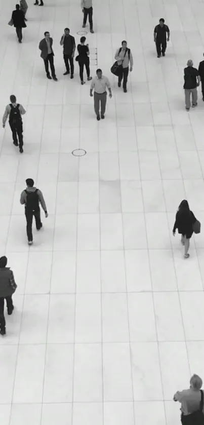 Monochrome urban walkway with people walking.