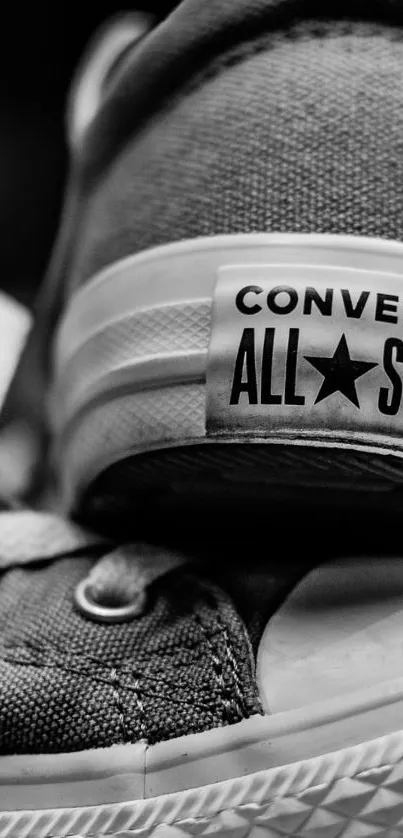 Close-up of monochrome Converse sneaker in black and white for mobile background.