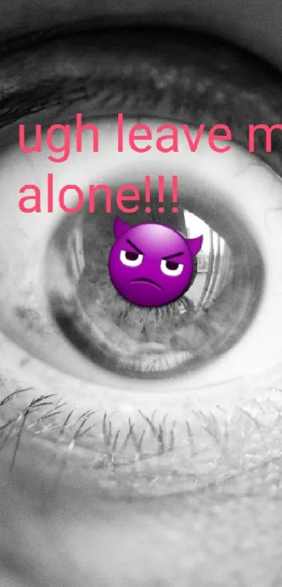 Monochrome eye with emoji saying 'ugh leave me alone!' on mobile wallpaper.