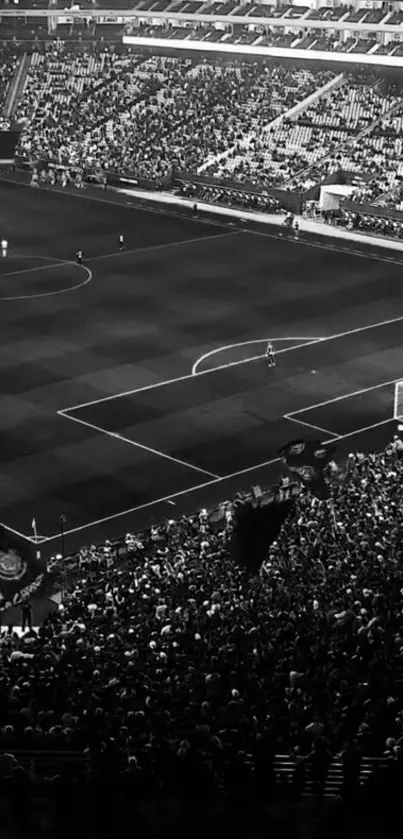 Monochrome wallpaper of a crowded football stadium.