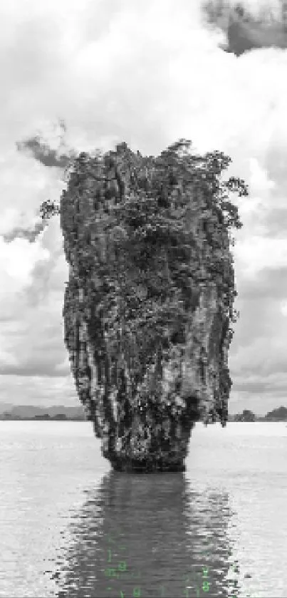 Monochrome image of an island landscape with rocky cliffs and cloudy sky.