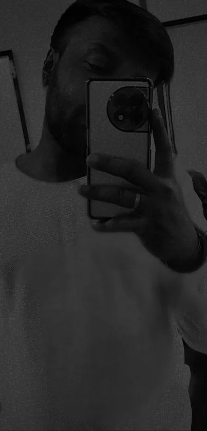 Monochrome mobile phone reflection with dark aesthetics.