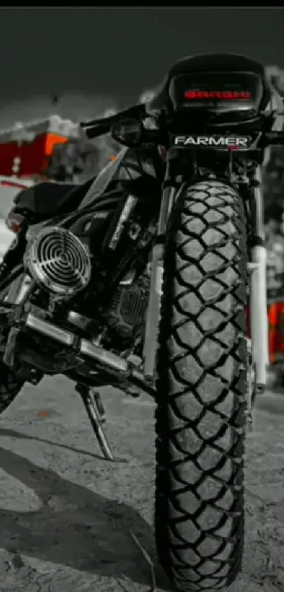 Monochrome motorcycle wallpaper with red accents on a roadside.