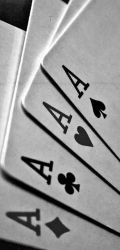 Black and white mobile wallpaper with aces playing cards.