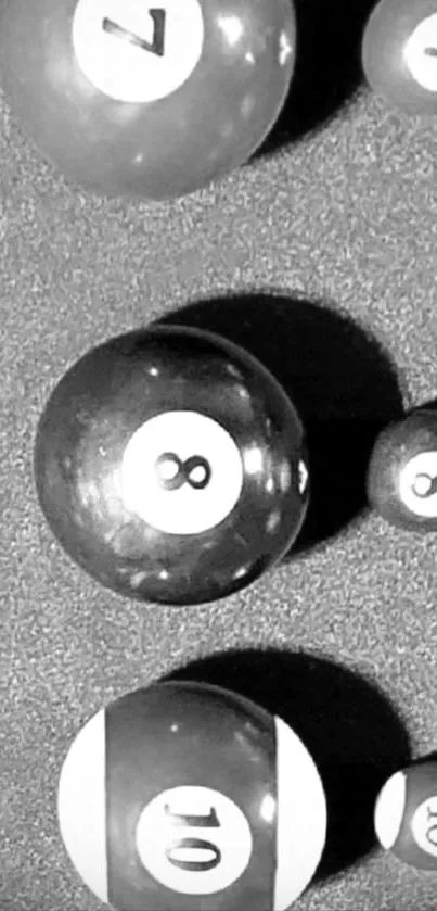 Monochrome pool balls art on mobile wallpaper.