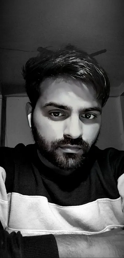 Monochrome portrait of young man in deep thought.