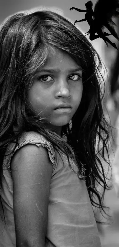 Black and white portrait of a girl with a fairy silhouette in the background.