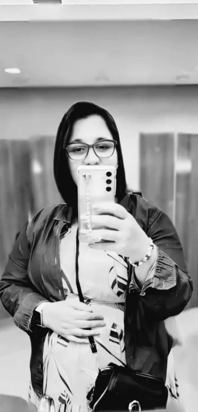 Monochrome mirror selfie capturing stylish reflection and elegant vibe.