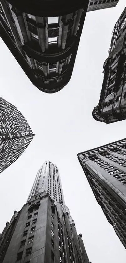 Upward view of monochrome skyscrapers with dramatic perspective.