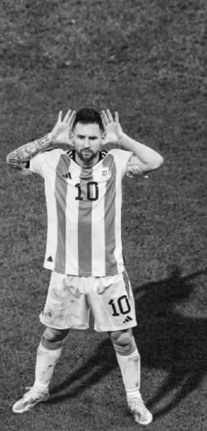 Black and white image of a soccer player celebrating.