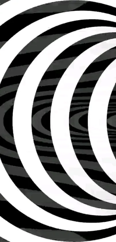 Monochrome spiral pattern with black and white concentric circles.