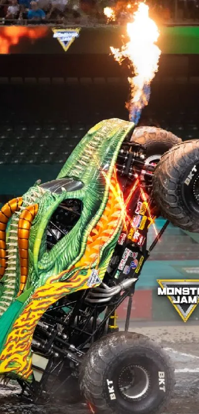 Monster truck performs fiery stunt in arena.