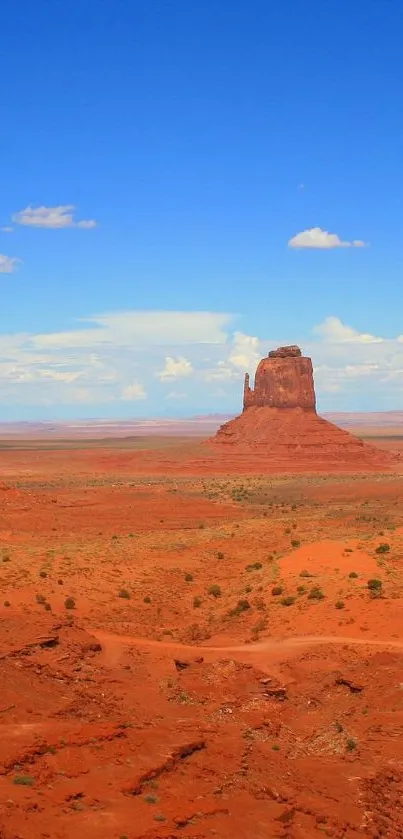 Monument Valley with red rocks under a blue sky, perfect for mobile wallpaper.