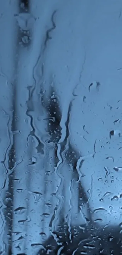 Blue wallpaper with raindrops on glass creating a moody and calming atmosphere.