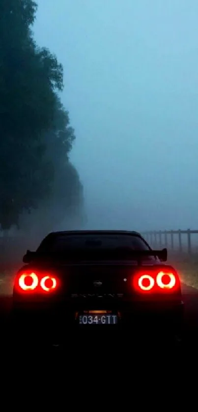 Car on a foggy road with red tail lights glowing brightly.