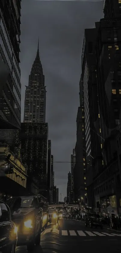 Moody city night view with towering buildings and bright streetlights.