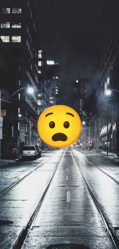 Moody city street at night with a large emoji.