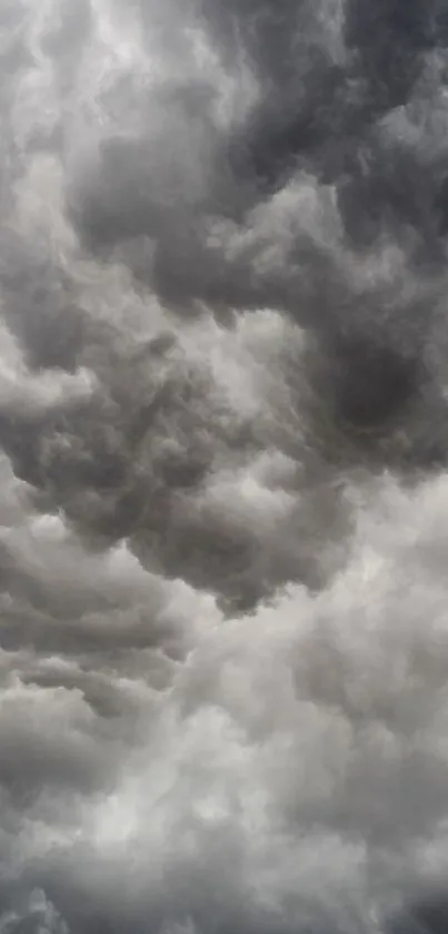 Moody grey clouds in a dramatic sky wallpaper.