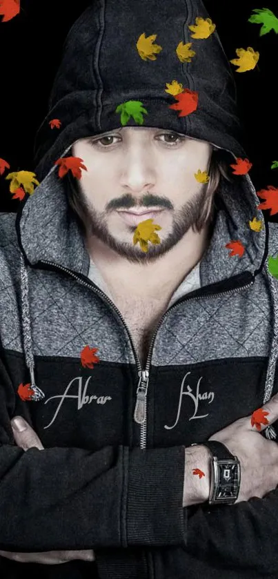 Moody portrait in hoodie with autumn leaves.